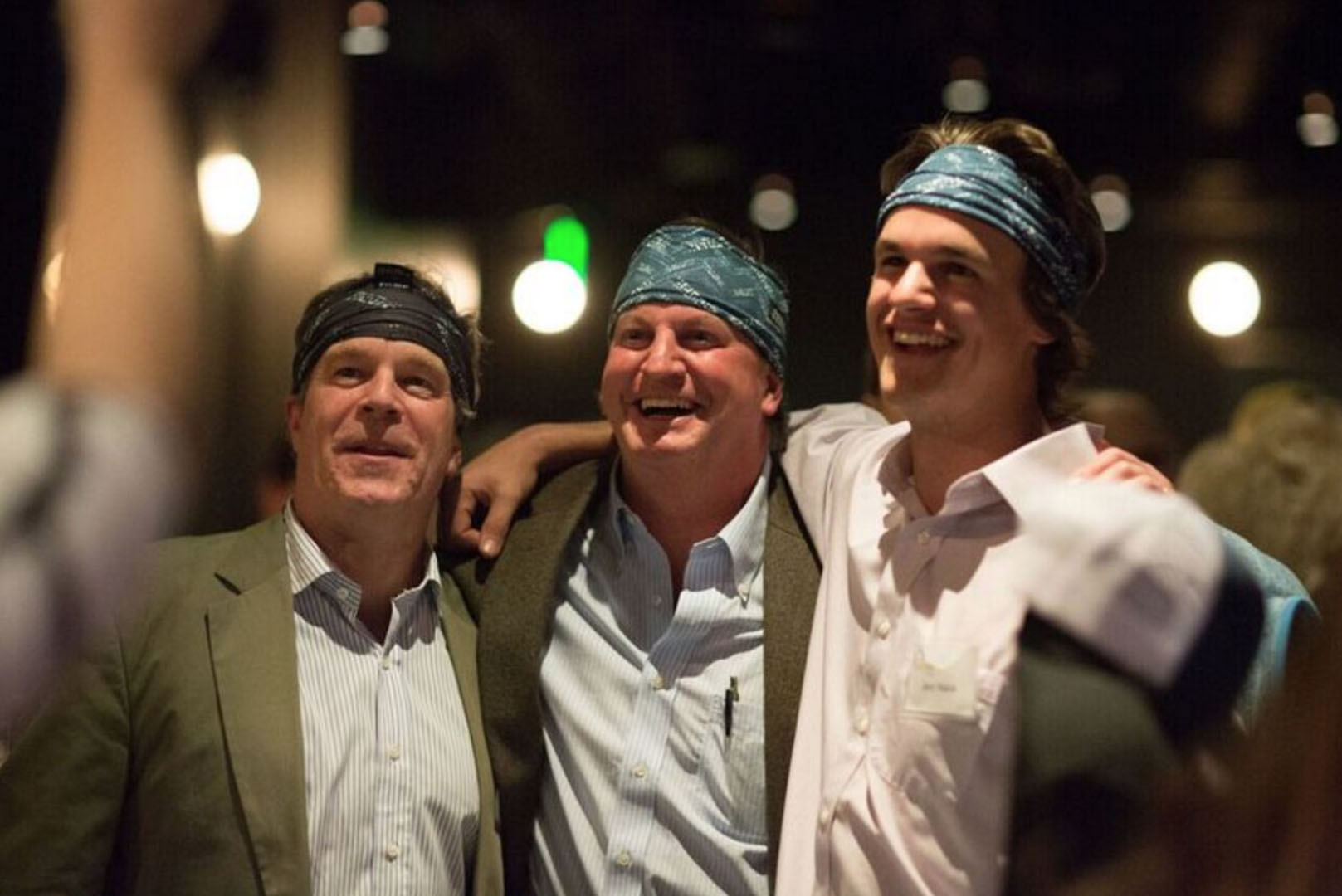 Guests laughing together during a live comedy performance
