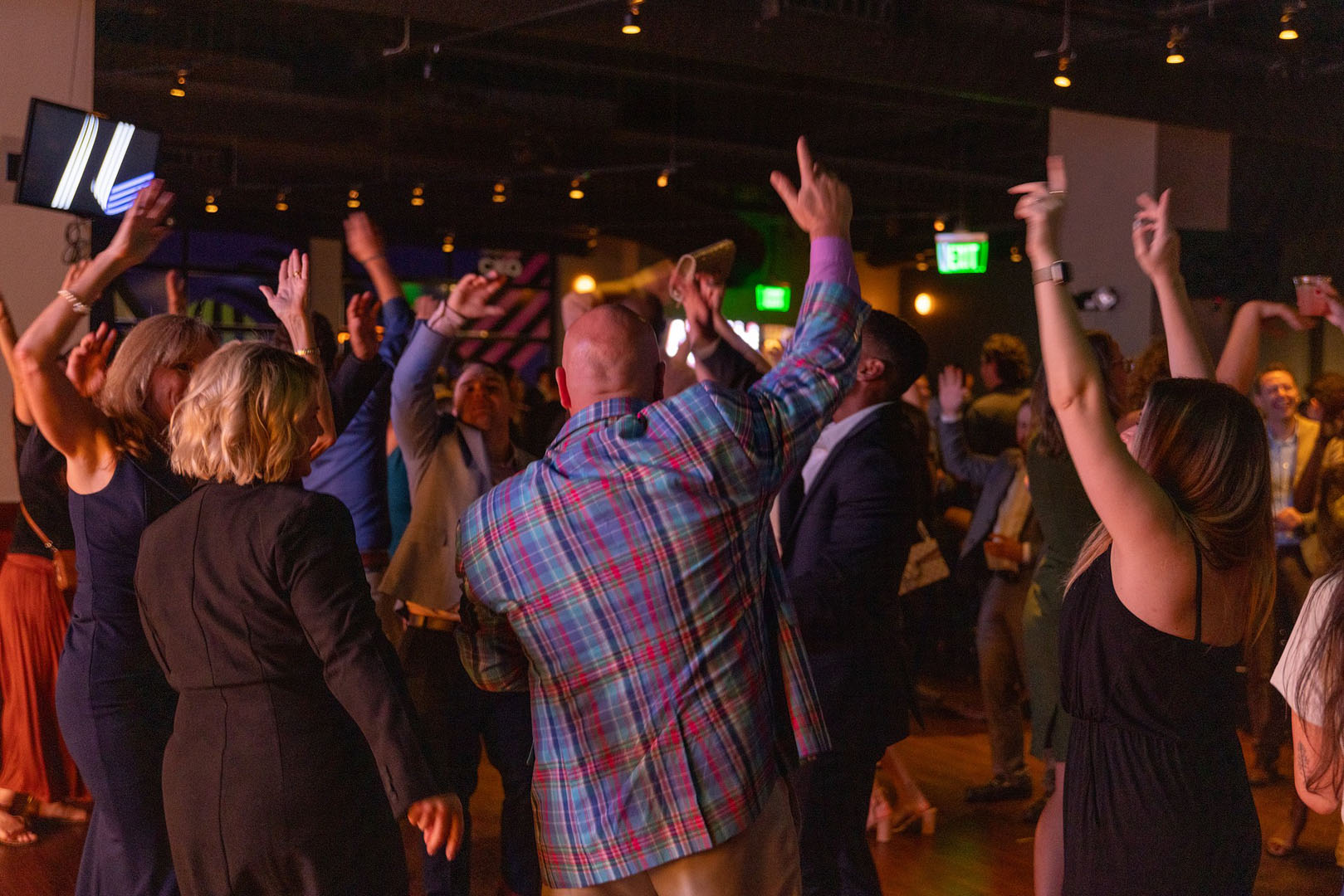 Guests cheering together at a lively private event